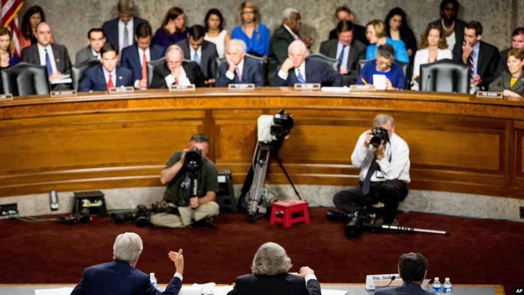 FILE - From left, Secretary of State John Kerry, Secretary of Energy Ernest Moniz and Secretary of Treasury Jack Lew testify at a Senate Foreign Relations Committee hearing to review the Iran nuclear agreement, in Washington, July 23, 2015.